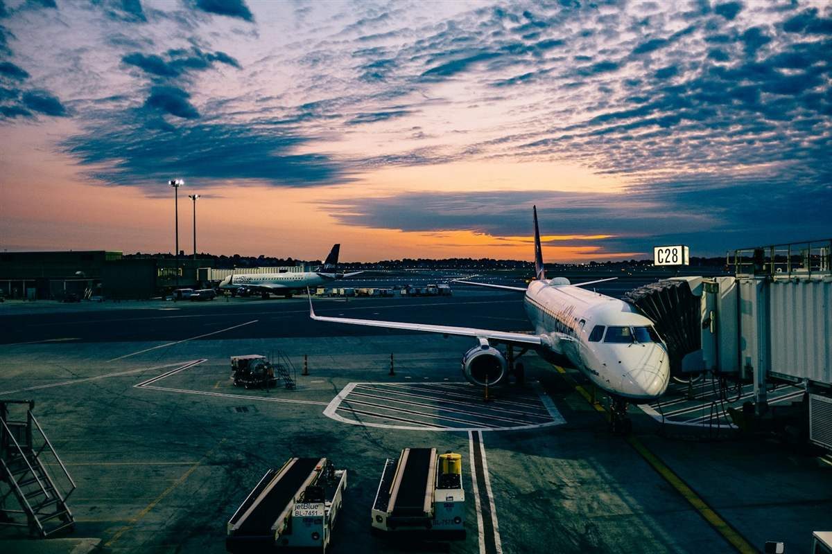 Airport and flight travel scene related to trip delay and travel insurance coverage