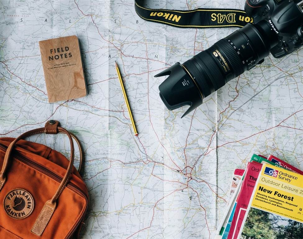 Travel suitcase and trip planning representing travel insurance coverage in the USA