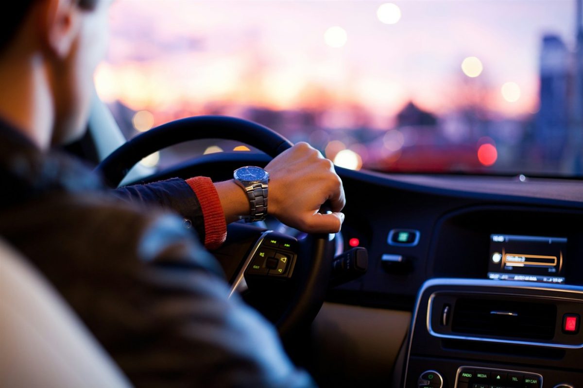 Driver on a USA highway representing car insurance coverage and auto protection