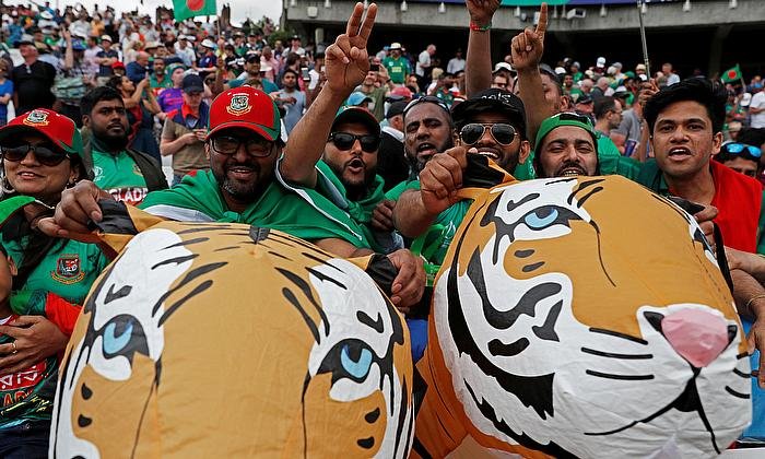 Fans celebrating a cricket match victory